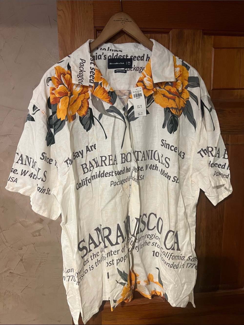Aeropostale White Button-Down Shirt with Yellow Floral and Black Script